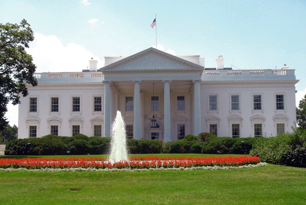 North facade of the White House with columns, portico and circular drive.