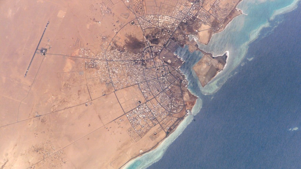 Satellite-style photo of the coastline and urban area of Yanbu, Saudi Arabia, on the Red Sea.