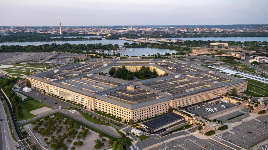 Aerial view of the five-sided Pentagon building and surrounding parking areas.