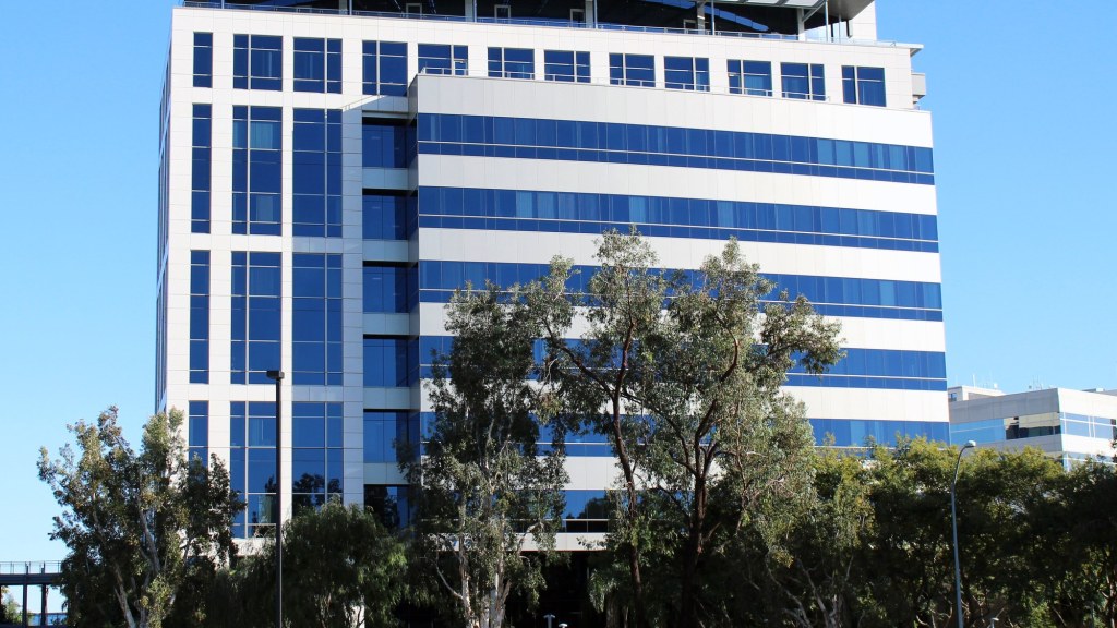 Modern glass office buildings with the Qualcomm name on the company's San Diego campus.